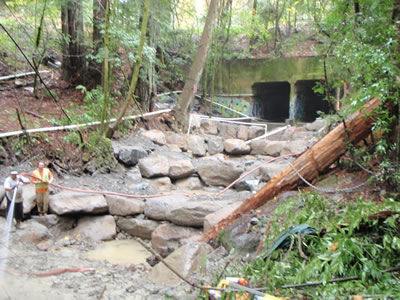 Finishing installation of rock weirs to assist fish passage through underpass on Dutch Bill Creek